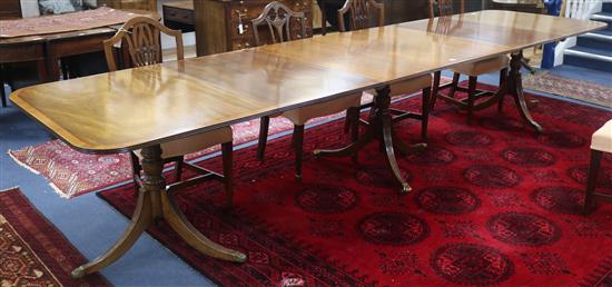 A Regency style mahogany extending pedestal dining table and two spare leaves, W.386cm with leaves fully extended